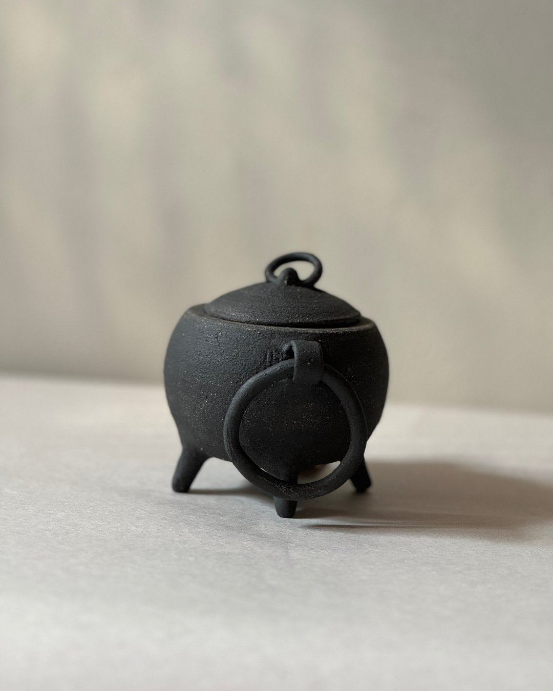 black ironstone cauldron with loop ceramic handles