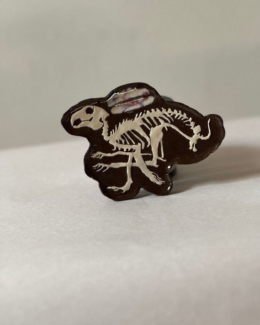 Small tray adorned with carved rabbit bones displayed standing up