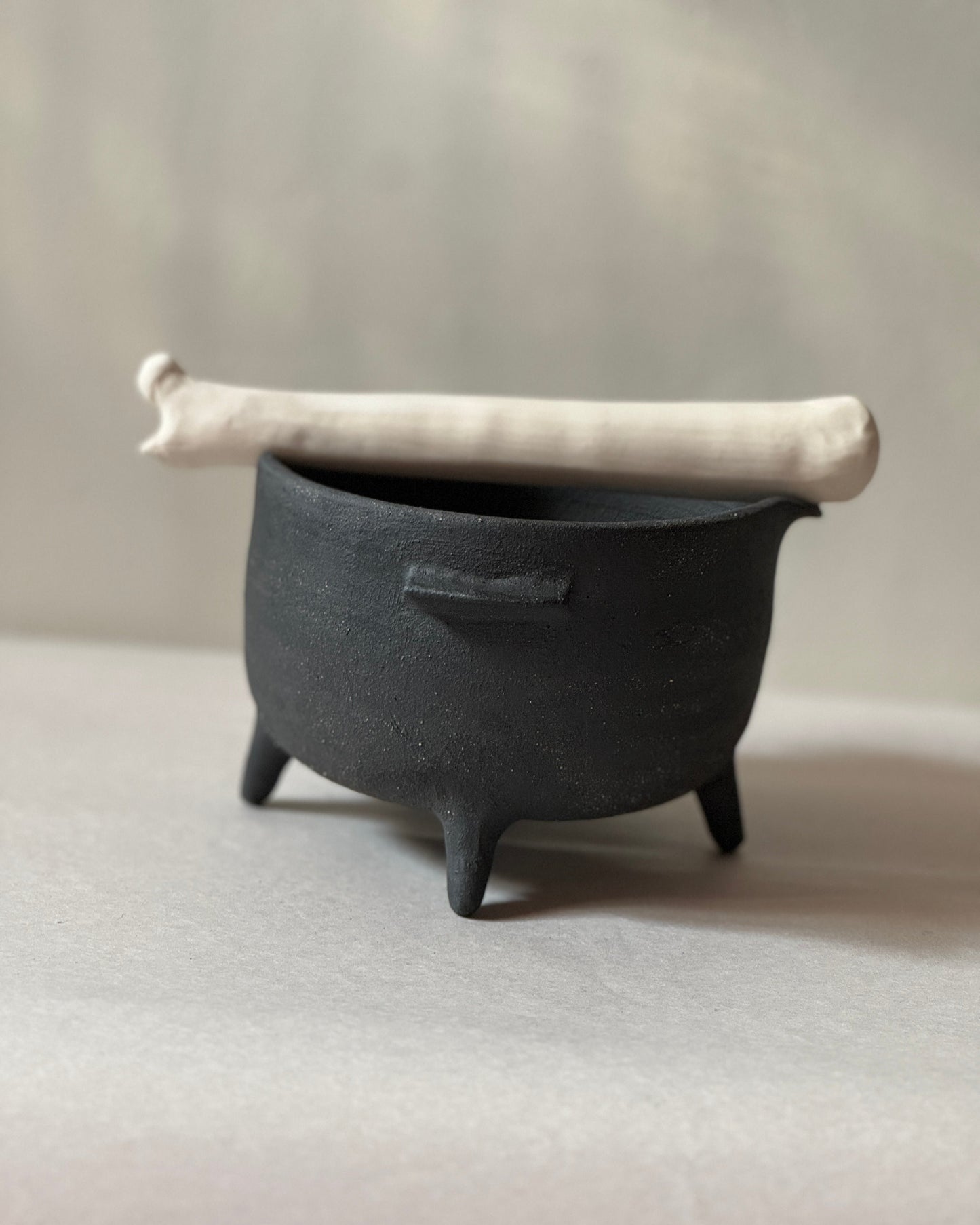 black ironstone ceramic mortar and pestle with ceramic bone shaped pestle